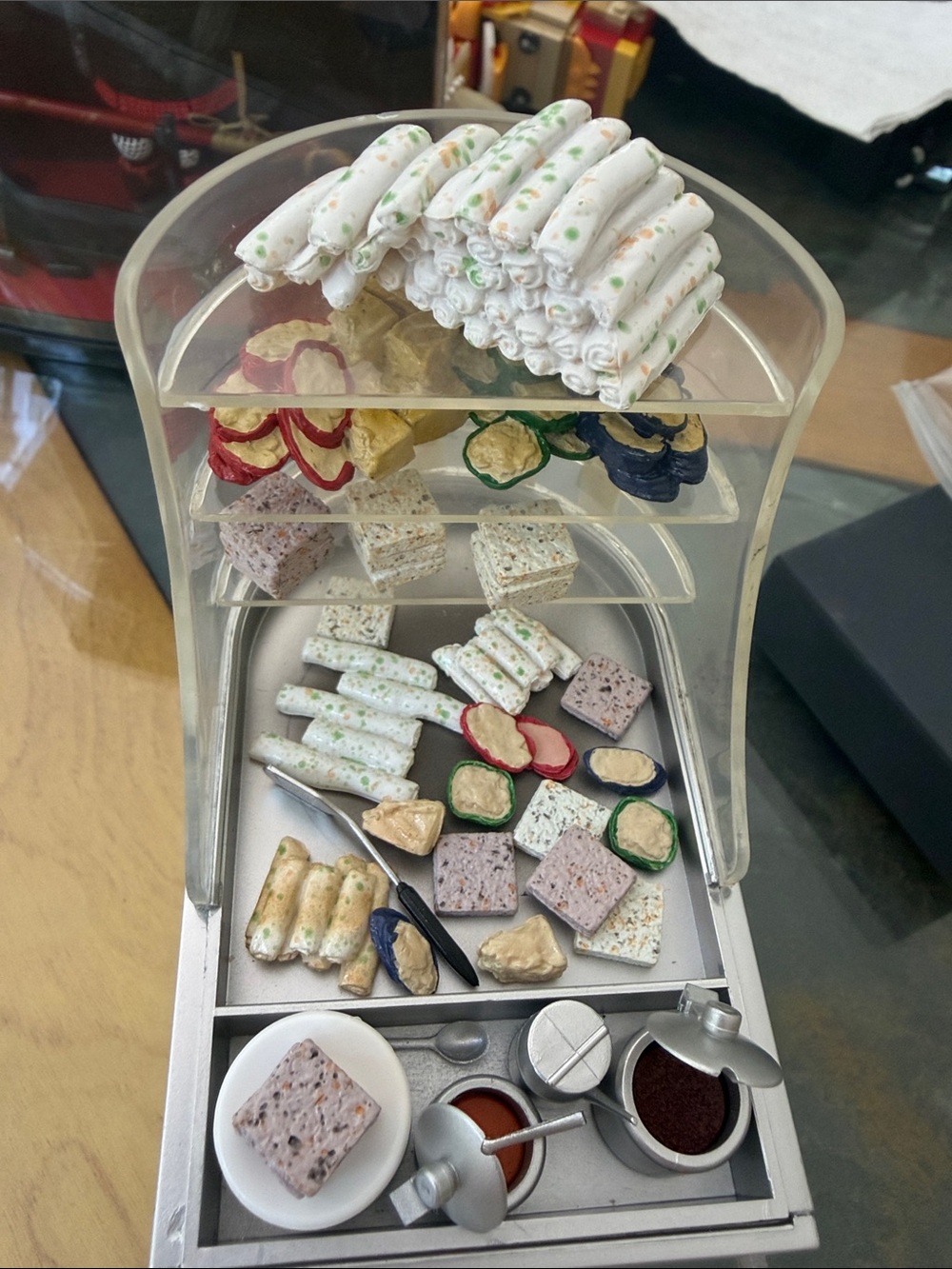 Miniature Pastry Display with White and Green Accents